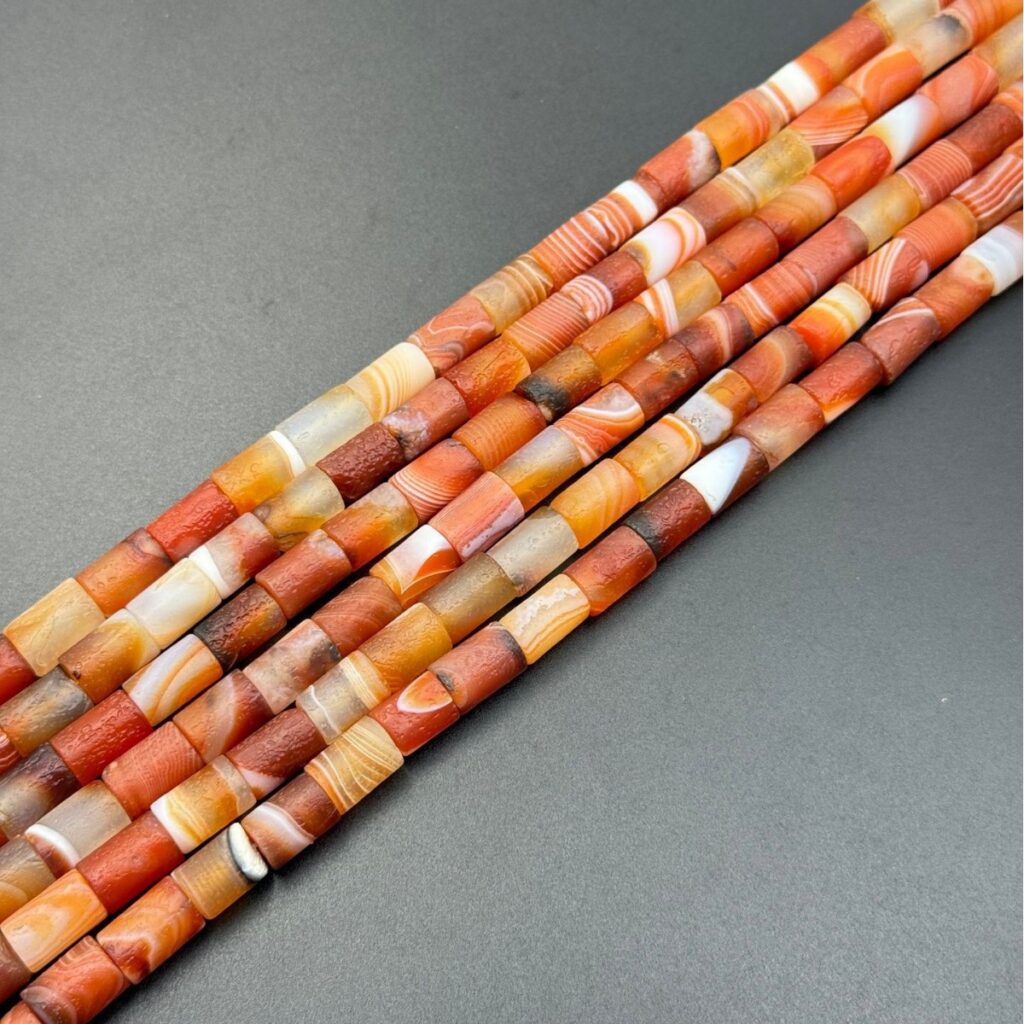 Aged striped agate barrel bead strands