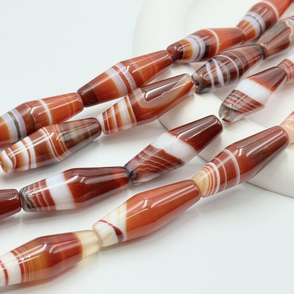 Banded agate pointed rice bead strands