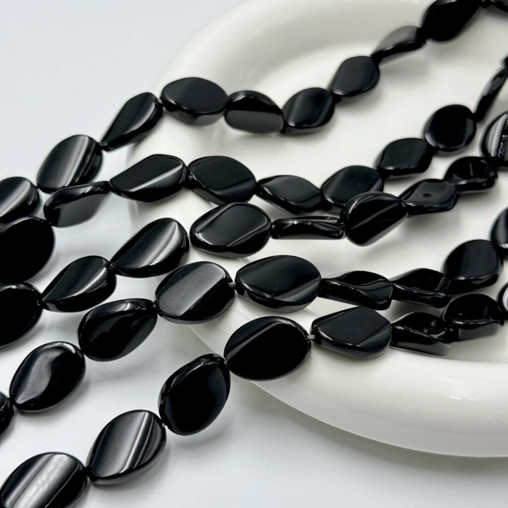 Natural black agate twist oval bead strand