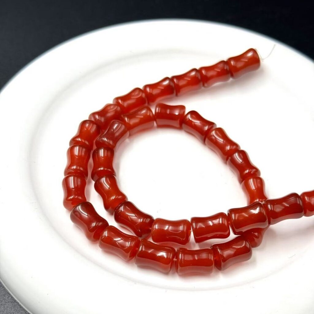 Red agate bamboo tube bead strand