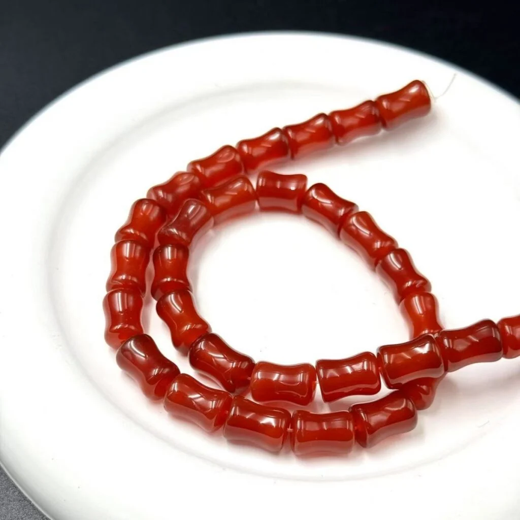 Red agate bamboo tube bead strand
