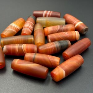 Tibetan red striped agate dzi bead