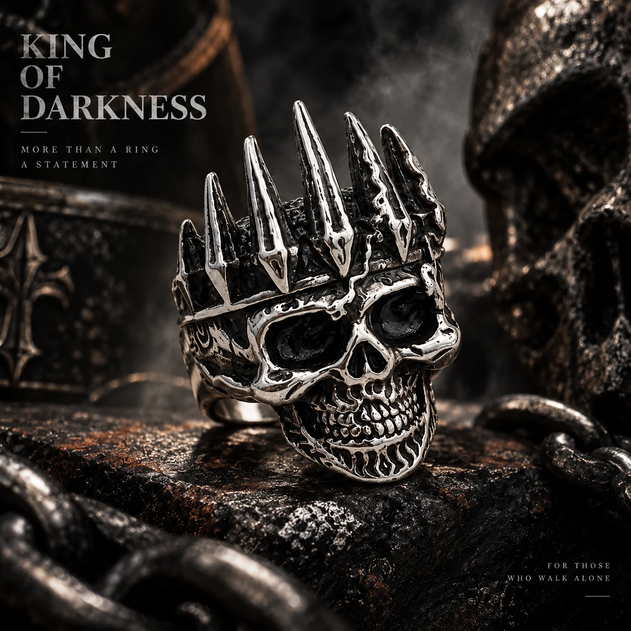 Silver-tone skull ring with a crown against a dark stone background.